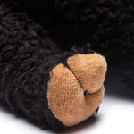 Close up of paw of the organic and Fair Trade stuffed animal Black Bear plush toy by bears for Humanity