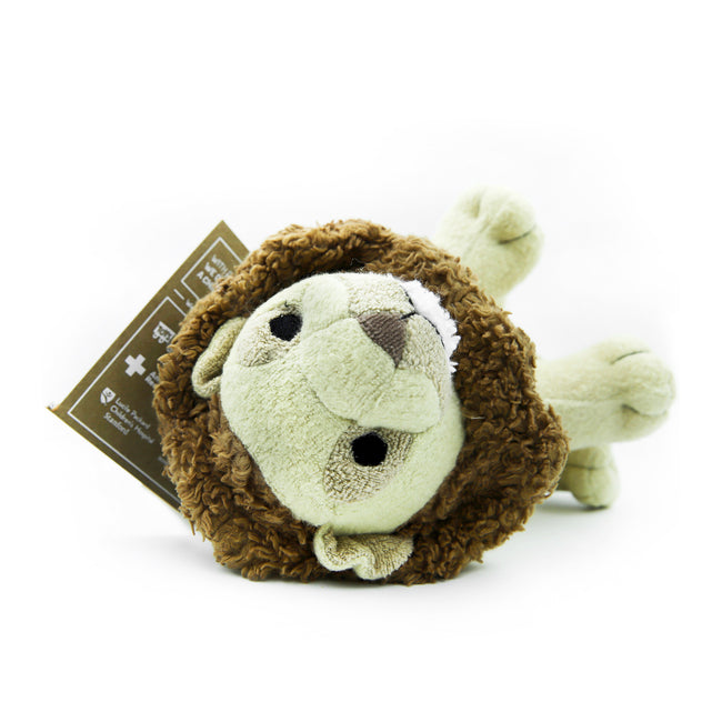 Organic Lion stuffed animal lays on his back